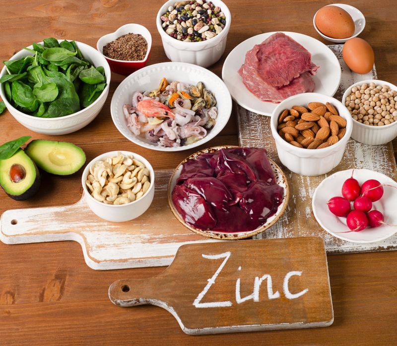 55559993 - foods with zinc mineral on a wooden table. top view